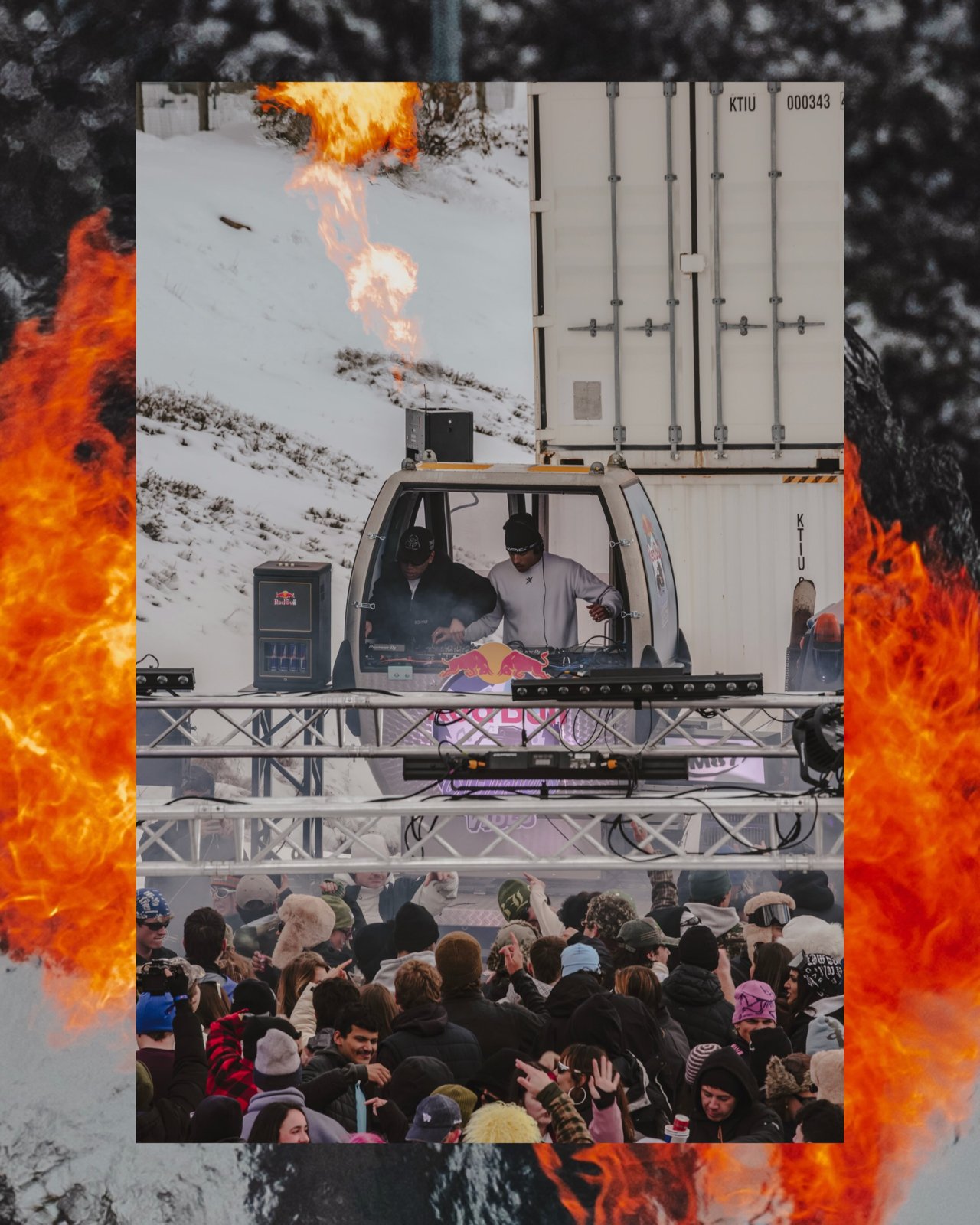 DJs in the Red Bull gondola on the truss stage, framed by flame effects